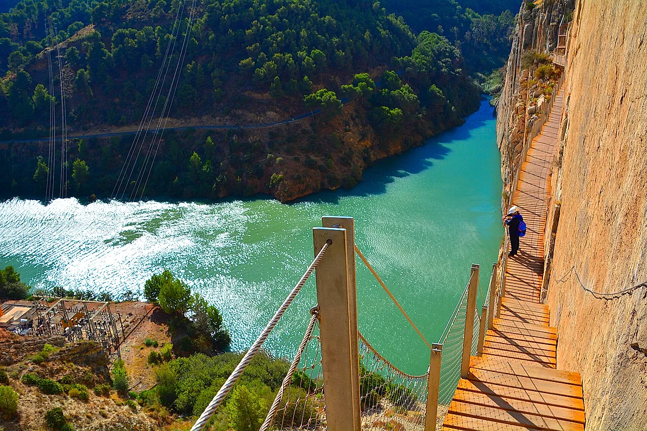 The walkway beside the turquoise reservoir
