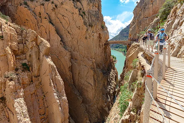 The boardwalk running along the cliff above turquoise water